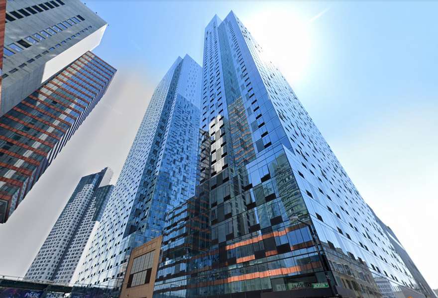 a very tall skyscraper positioned within a city
